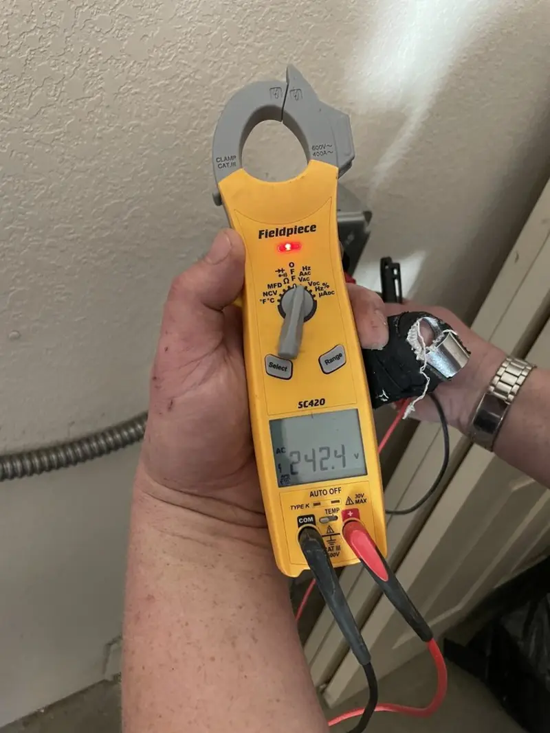 Voltage testing with clamp meter during Ceiling Fan Installation in Surf City